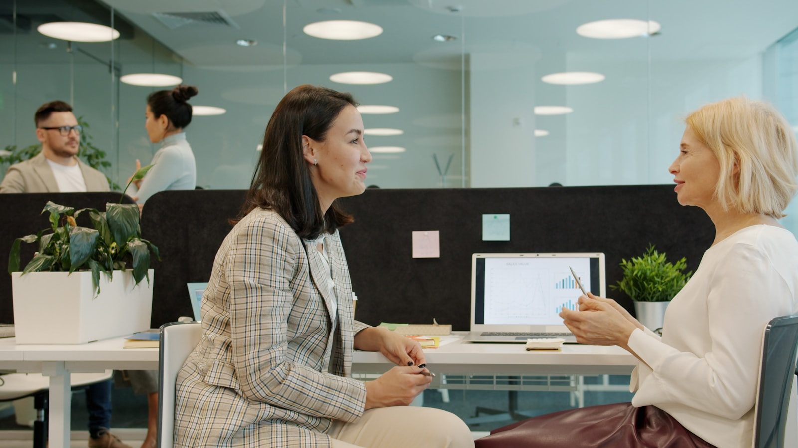Colleagues in a modern office reviewing work together